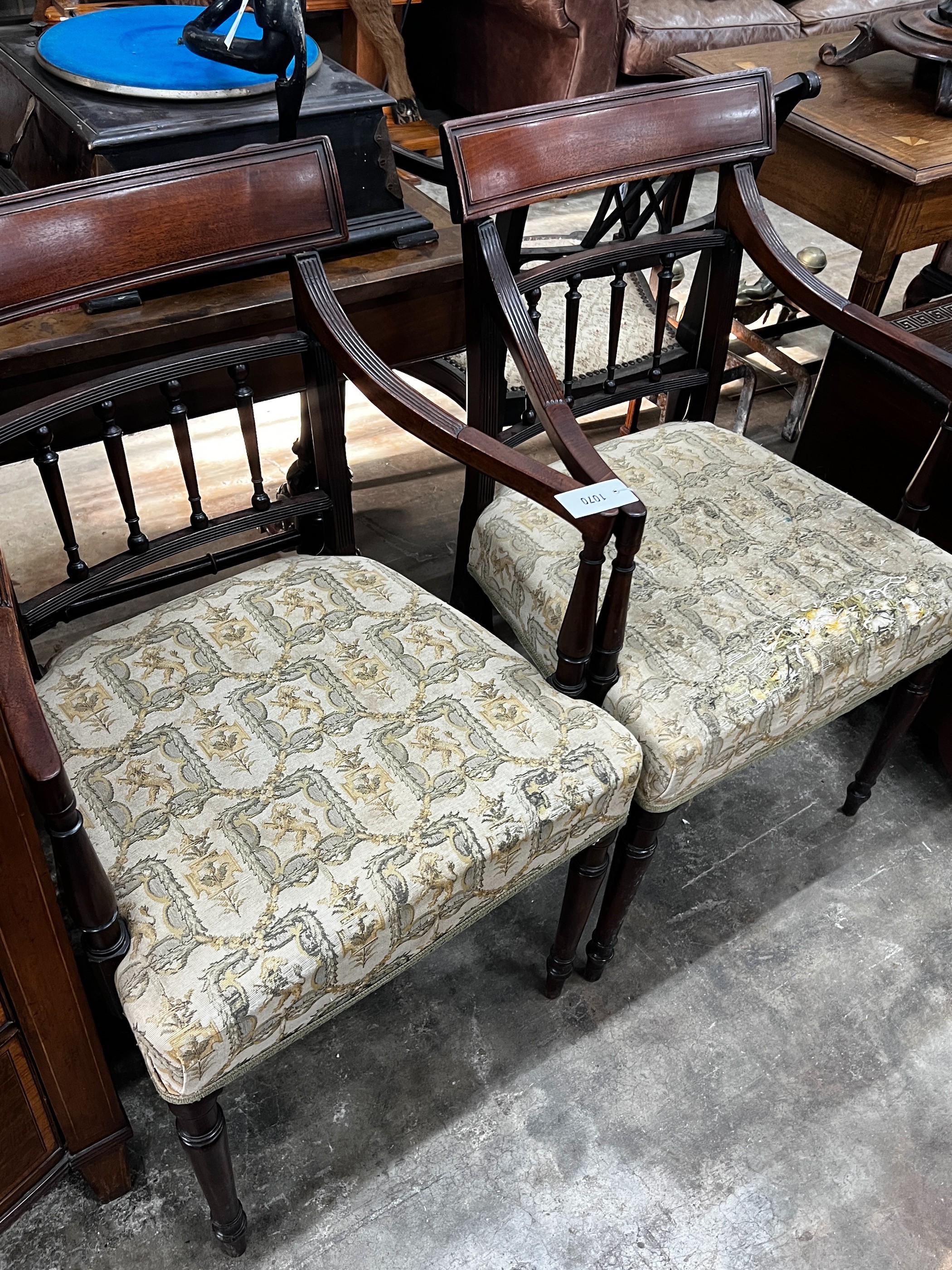 A pair of George III mahogany elbow chairs, width 52cm, height 88cm